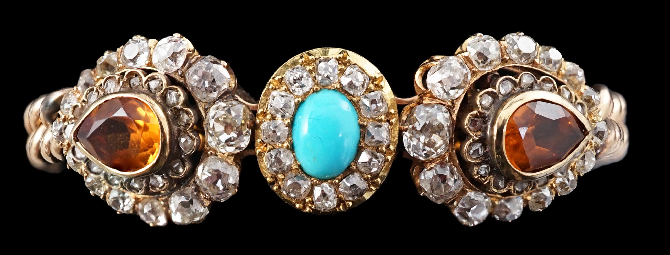 An Edwardian 15ct gold, citrine, turquoise and diamond set triple cluster set curblink bracelet